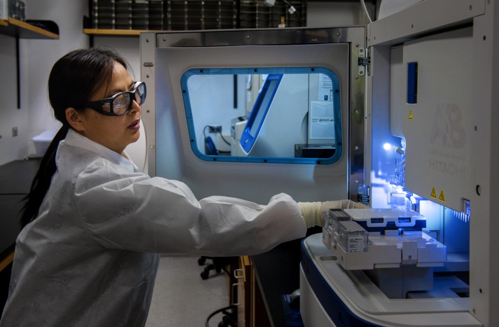 A healthcare professional runs tests at the Centers for Disease Control. Healthcare is highly regulated and interstate rules are constantly changing.