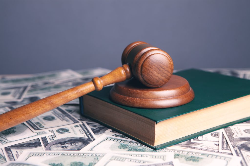 gavel on book with money