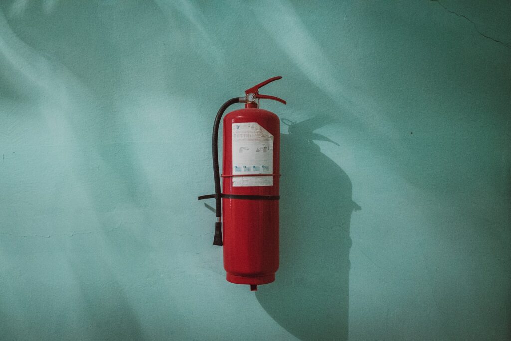 Fire extinguisher hanging on a wall.