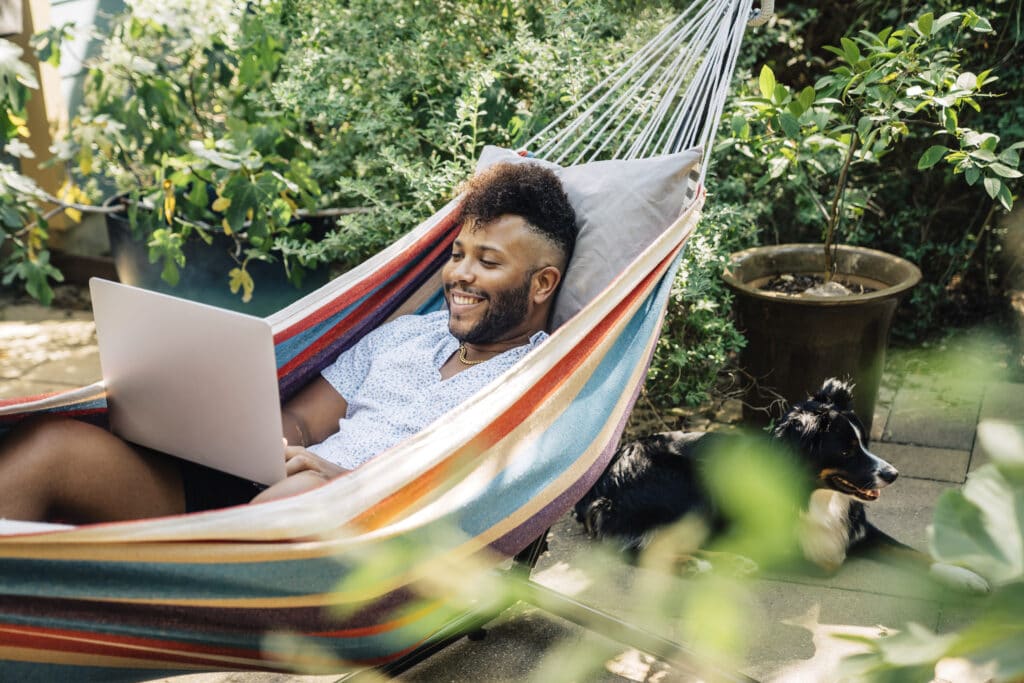 Guy laying in a hammock