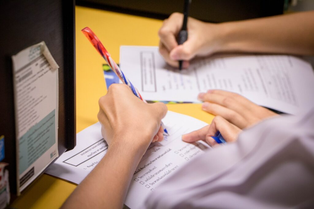 Person filling out paperwork