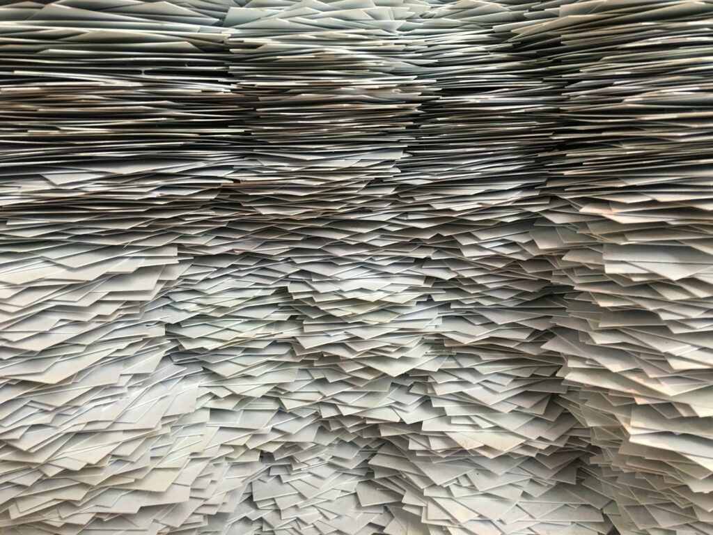 A wall of stacked paper