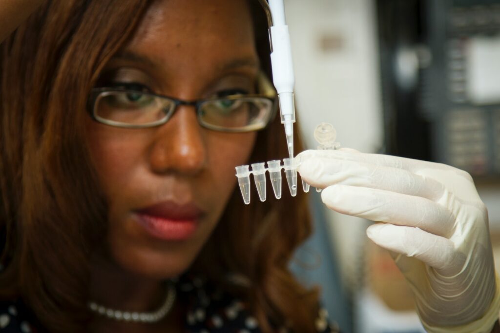 Lab worker running tests