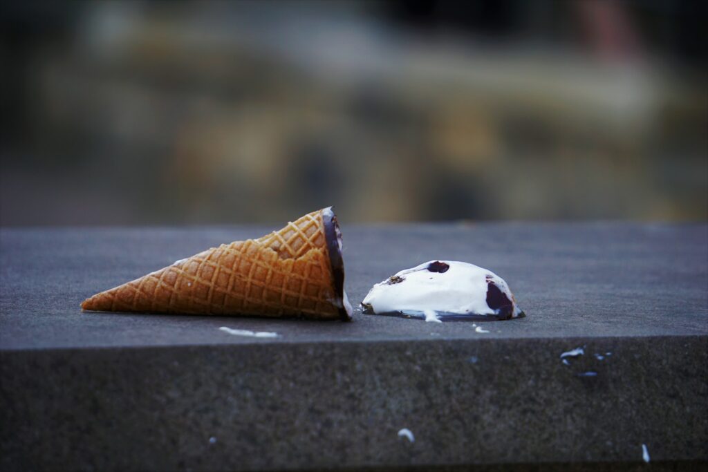 an ice cream cone on the ground