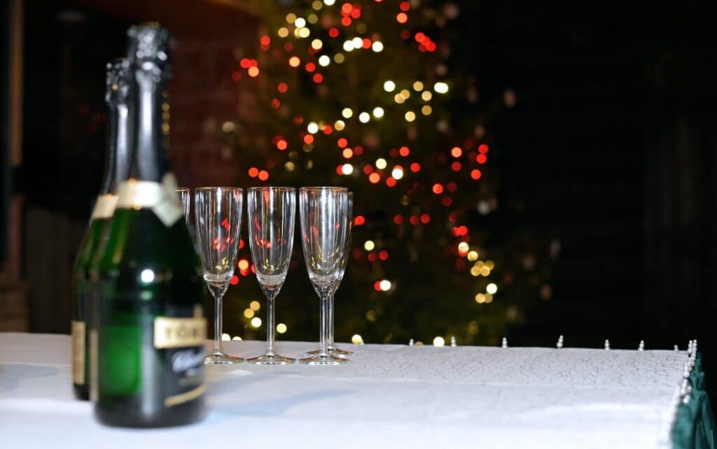 a table with glasses and a bottle