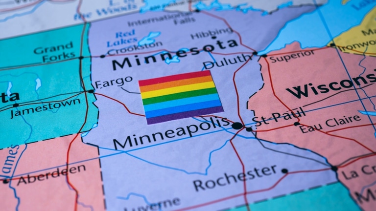 Map of state of Minnesota with a Pride flag.