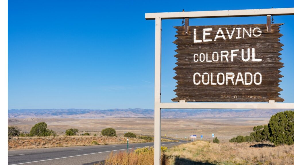 Picture of roadside sign "Leaving Colorful Colorado"