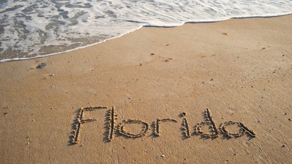 "Florida" written in the sand
