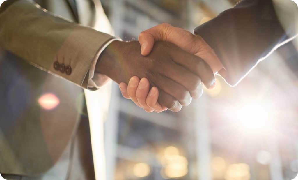 Two people shaking hands.