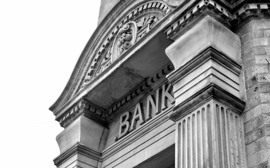 black-and-white entryway to a bank carved in stone
