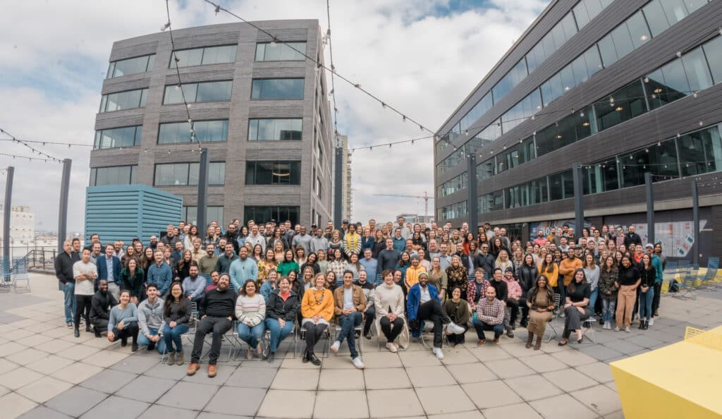 Decorative Image: Employees of Agentsync sitting together